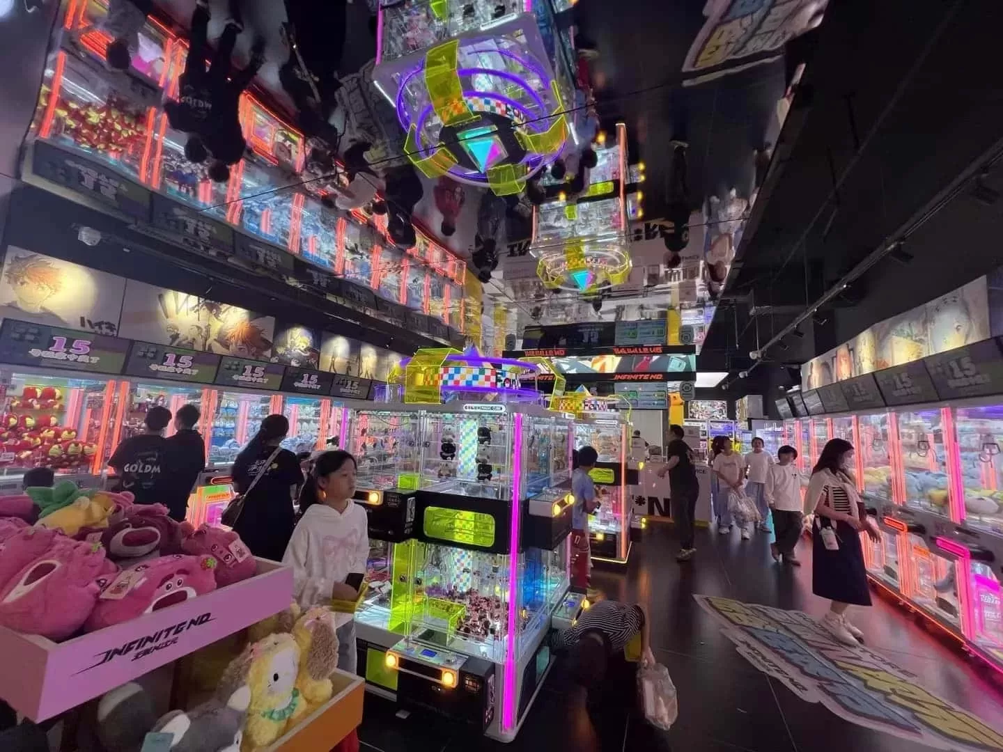 Claw machine filled with colorful plush toys in arcade